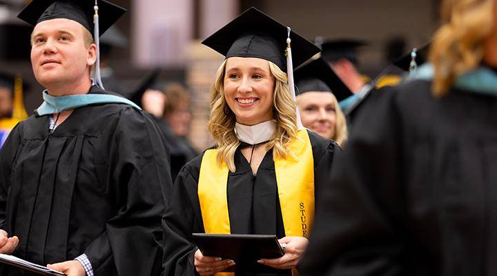 A graduate at the commencement ceremony in Rice Auditorium