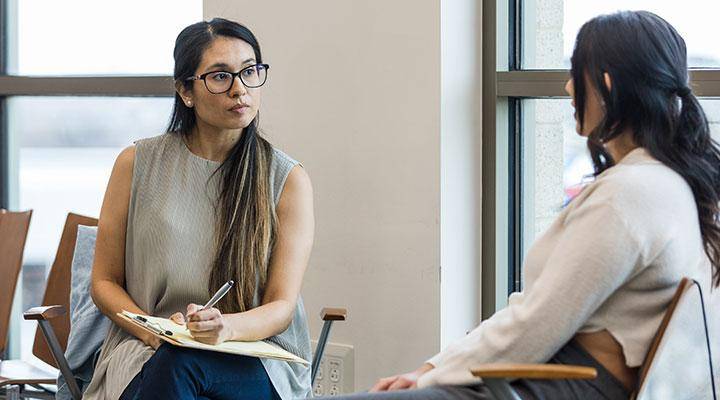 A counselor works with a client