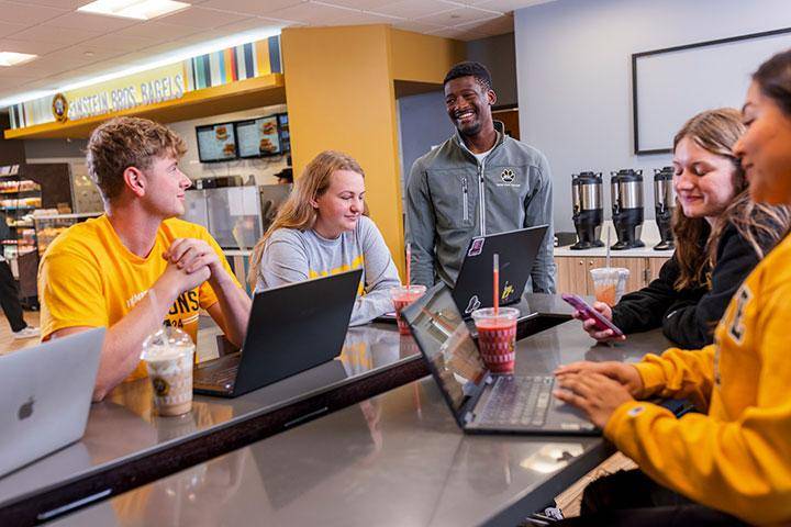 Students spend time together at Einstein Bros. Bagels