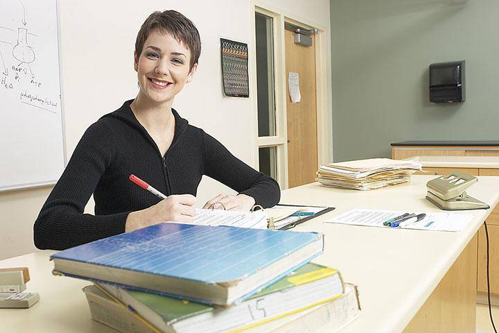 A teacher sitting at a desk