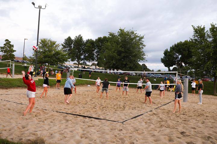 Students participate in intramural sand volleyball