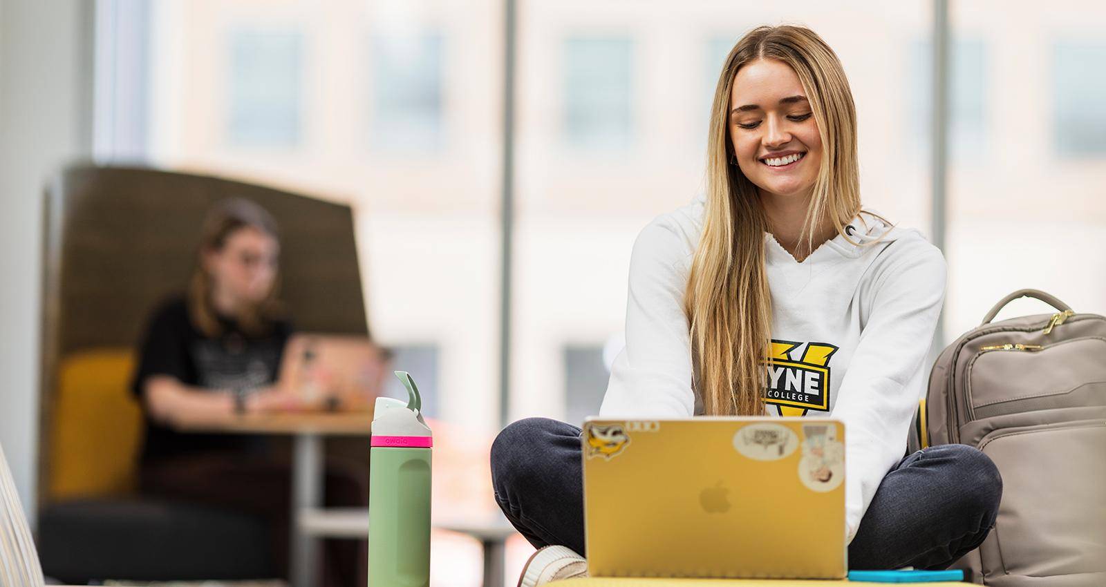 A student works on a laptop