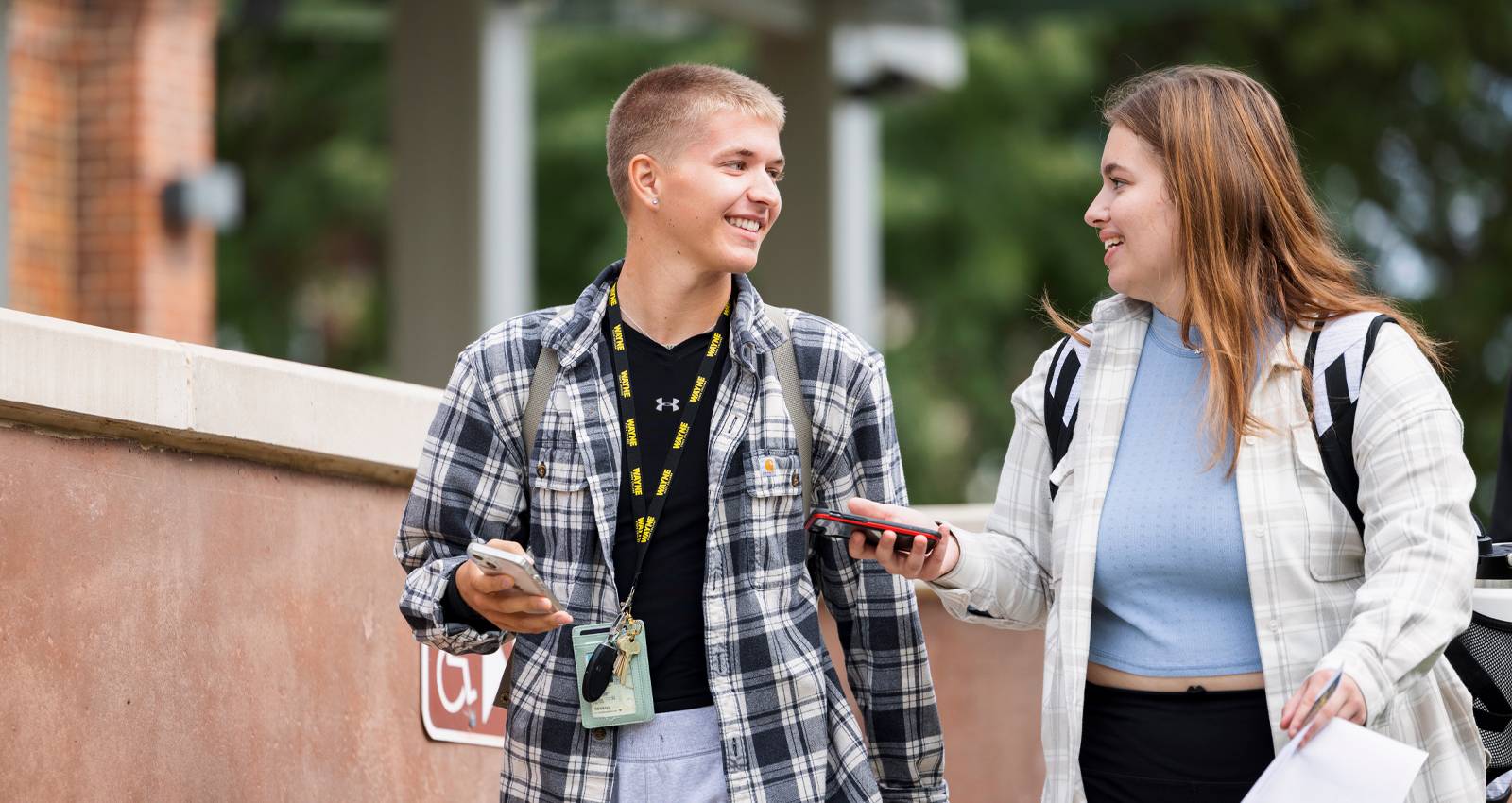 Two WSC students walk across camps