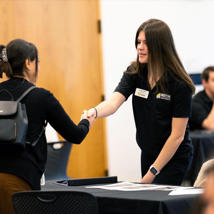 A student meets an employer through the WSC cooperative education program