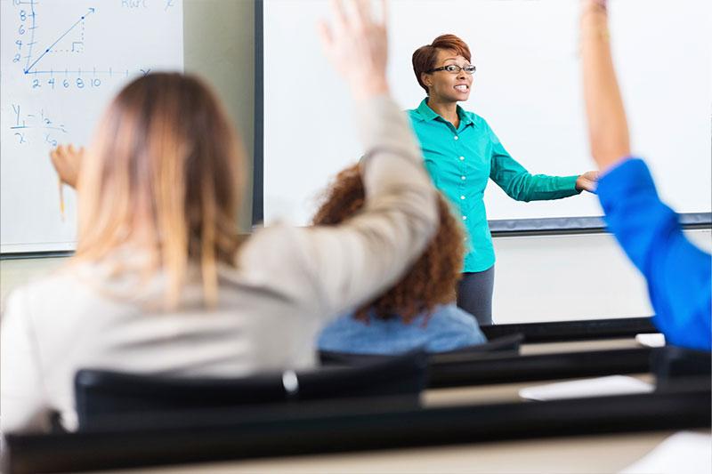 A teacher leads a classroom discussion