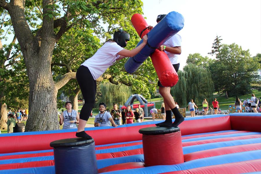 Students enjoy inflatable jousting at a WSC carnival